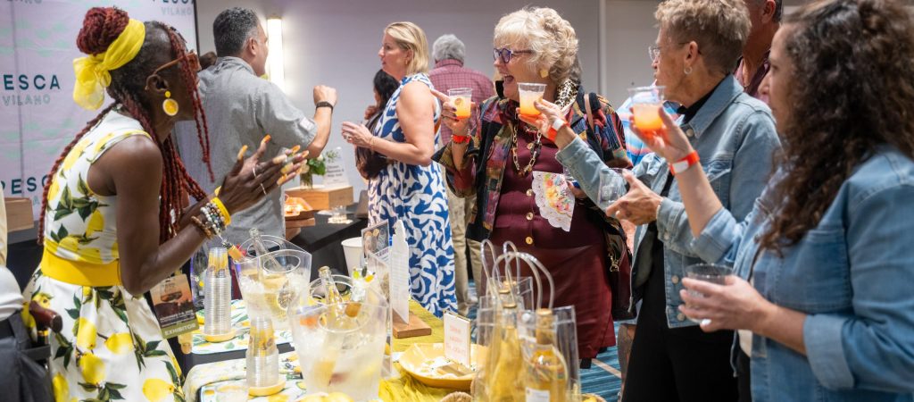 Guests toasting cocktails at a Pesca Vilano celebration